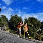 Dunedin surveyors Dylan Hills (left) and Toby Stoff start creating a super-accurate model of...
