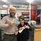 The new coupon book gets the thumbs-up from Brett Jones, owner/manager of the Amberley Post Shop,...
