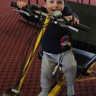 Although he cannot yet reach the pedals, 2-year-old Riley Slater was keen to try out the electric...