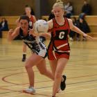 Lincoln A centre Madeleine Walker, right, beats her Southbridge oppositeBeth Williamson to the...