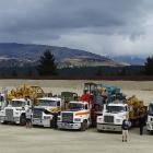 Wheels at Wanaka general manager Allan Dippie takes a photo of the drivers and the 12 trucks...