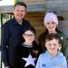 New Duntroon School principal Mike Turner with his children Ruby (9, left), Hazel (11), and...