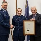 Sergeant Bridget Martin receives her Woolf Fisher Police Fellowship from (left) Commissioner of...