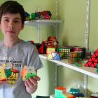Dunedin speedcubing fan Isaac Latta (14) can solve a variety of puzzles at high speed. Photo:...