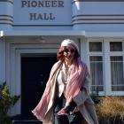 Artist Jenny Kendrick dances outside Pioneer Hall in Port Chalmers. Photo: Shawn McAvinue