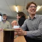 Humanities academics Greg Dawes (left) and Jacob Edmonds with Wendy Dunn at a weekly pop-up cafe...