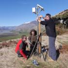 Simon Croft, Billy Barton (trapping manager) and Tim Sikma install a satellite trap aerial in the...
