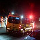 Fire and Emergency workers attend a crash scene in Corstorphine Rd last night. PHOTO: CRAIG BAXTER
