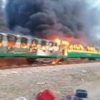 Video grab of a fire burning in a train carriage after a gas canister passengers were using to...