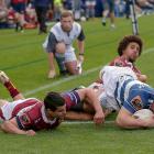 Dalton Papalii of Auckland beats Josh Moorby (L) and Isaac Te Tamaki of Southland to the line at...