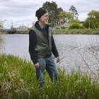 Henley resident Allan Innes stands on a flood bank protecting the settlement. Photos: Gerard O...