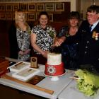 Senior firefighter/driver Roy Adams and his wife, Annette, with their daughters Helen, left, and...