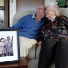 Stan Aimes plants a kiss on the cheek of wife Nancy before their 70th wedding anniversary today,...