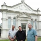 Eveline Presbyterian Church elder Colin Harvey (left), Church of God pastor Eugen Dupu and the...