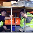 Cargill Enterprises workers Nicola Ralston (left) and Lorraine Tecofsky take part in ShakeOut,...