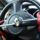 Anti-Theft Car Steering Wheel Lock. Black & red colors. Photo: Getty Images