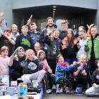 Volunteers painting a new mural in the Runciman St tunnel under the in Green Island (standing,...