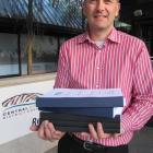 Central Otago District Council planning manager David Campbell holds the 2199-page agenda for the...