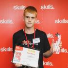 James Avenell shows his Top Junior Bright Spark award at Datacom in Auckland. PHOTO: SUPPLIED