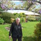 David Ford under a wisteria arch in his Tinwald garden.