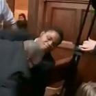 Ebenezer Azamati is pulled from his chair by security guards during a debate at the Oxford Union....