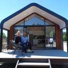 Claire and Peter Marshall on the deck of their Nautilus Modular house. Photo: Mark Price