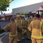 Fire crews at the scene outside the bank where the fire occurred. Photo: Pam Jones