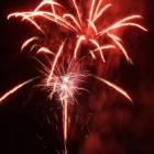 Fireworks over Queenstown Bay at midnight capped off New Year's Eve celebrations. Photo by Guy...