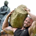 Police recruit Jayden Hill (31) proves his strength, lifting a 135kg rock in Dunedin’s Octagon...