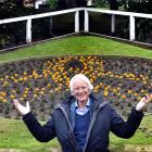 Showing off the site of the planned Archibald Baxter Peace Garden yesterday is Prof Kevin...