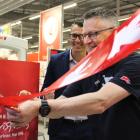 Invercargill Kmart store manager Forrest Worthen cuts the ribbon at the opening of the new store...