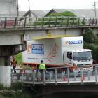 A Conroy Removals truck became stuck under the Humber St rail bridge in Oamaru yesterday after it...