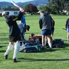 Regan Miller gets in a practice swing before batting for the Heat in the opening match of a new...