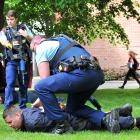 Simulating the apprehension of a criminal at the University of Otago as part of its emergency...