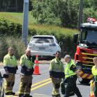 Emergency services at the scene of a crash in Waldronville. Photo: Craig Baxter