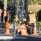 Workers from Citycare at work in Taieri Rd above Wakari Hospital after reports of a burst water...