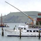 A 250-tonne Titan crane lowers the first section of a new fishing jetty into position at Boiler...