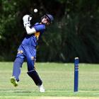 Taieri wicketkeeper Cameron Jackson bobbles a catch fromthe bat of Green Island opener Brad...