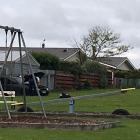 Police swarmed an Invercargill park yesterday after a driver crashed through a fence while...