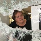 Ballantynes Showcase Jewellers owner Wendy Bradfield inspects damage to her shop in lower Thames...