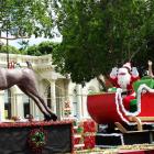 Santa waves to the crowd. PHOTOS: DANIEL BIRCHFIELD