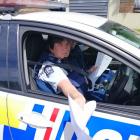 Constable Ruth Parsons hands trespass notices to environmental activist Sam Murphy in Dunedin...