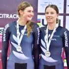 Nicole Shields (left) and Jesse Hodges take their spot on the podium after claiming silver in the...