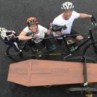 Riding in tandem with a coffin in tow to collect signatures to present to Parliament are Camilla...
