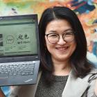 Xuan Luo, of China, shows off the new Dunedin City Council web page on which key information is...