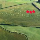 A pilot has captured a photo depicting a political statement mown into a Southland field. PHOTO:...