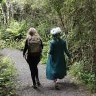 The writer (left) undergoes some nature therapy at Orokonui with tahu Mackenzie.