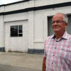 Former Oamaru borough councillor and deputy mayor Dr Ron Sim, outside a Coquet St building and...
