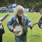 Enjoying a jam session on their banjos at the Whare Flat Folk Festival yesterday were (from left)...