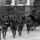 Crossing the Trinity College Green after the Easter Rising ended are New Zealand soldiers (from...